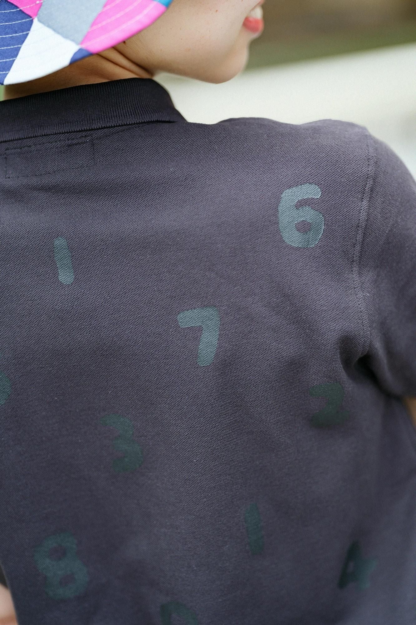 SO-SU-U Kurzarm-Poloshirt/Schwarz