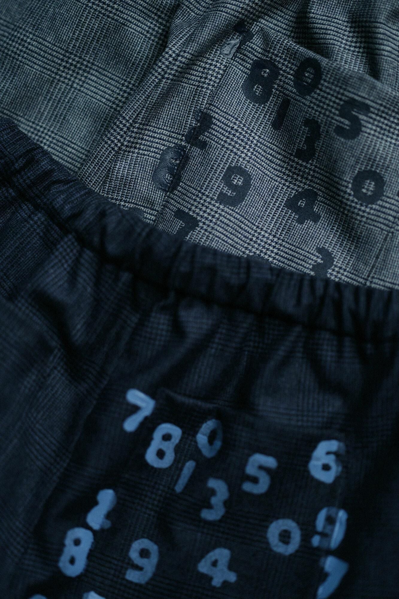 Weite Hose mit Hahnentrittmuster/Blaubraun