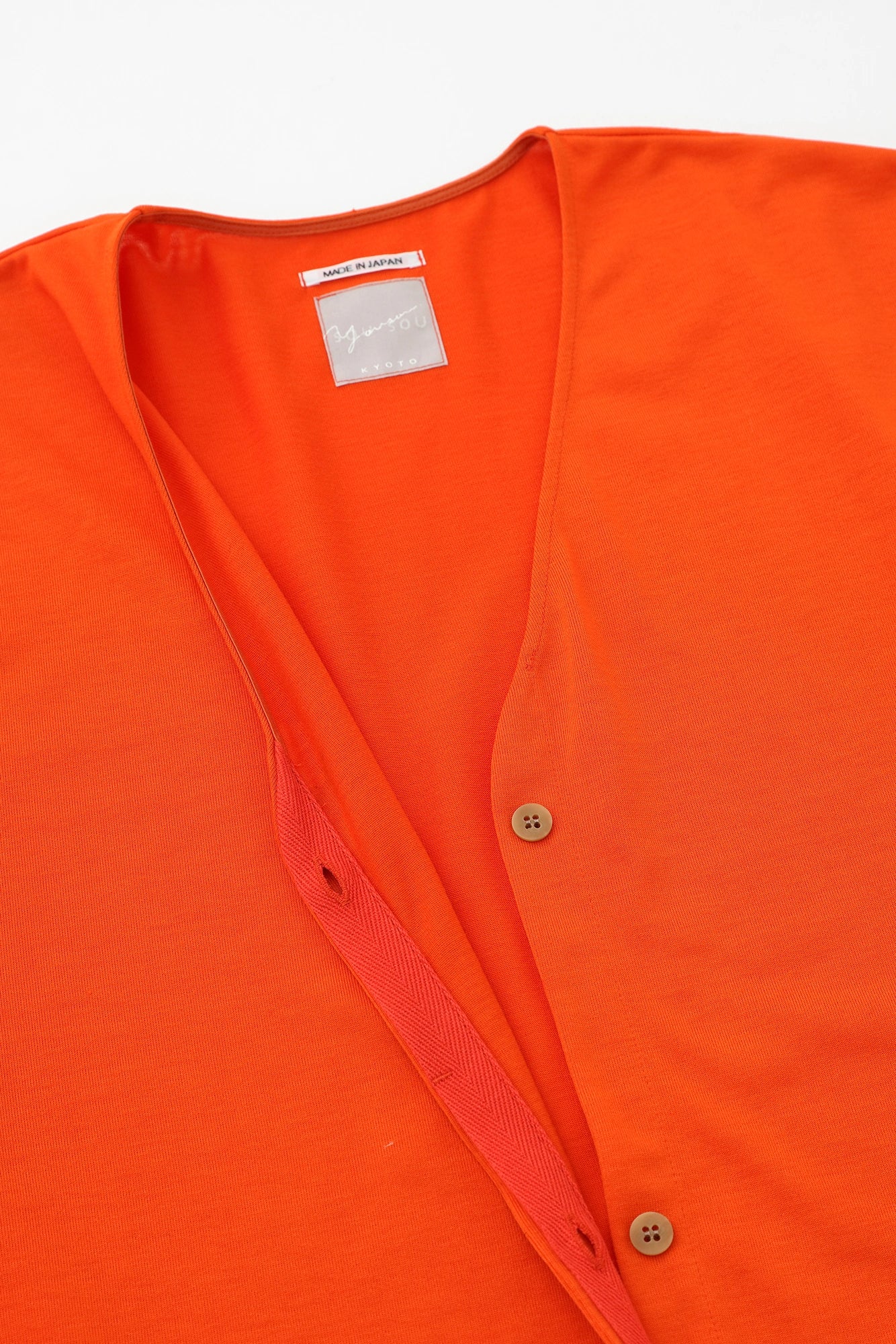 [Expédition prévue vers le 17 mars] Manteau tunique léger à col en V en jersey de fils parallèles/orange chromé